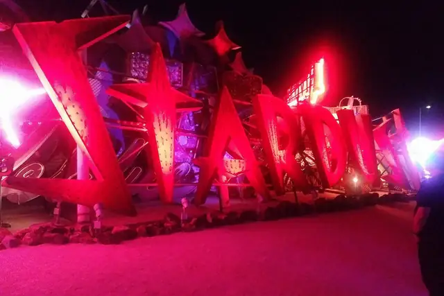 Giant red neon casino letters glowing at night